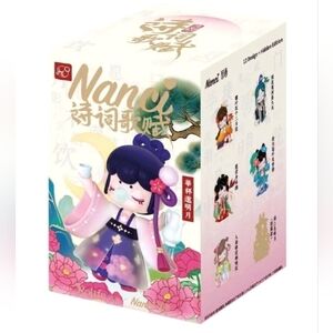 Charming Figurine with Green Kimono and Floral Details